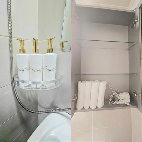 a bathroom with a toilet and a shelf with towels at 로맨틱 프라이빗 테라스, 무료주차, 2룸 in Daegu