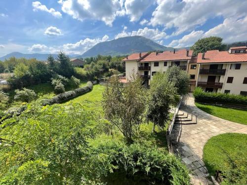 a view of a park with a building at Charme e Tranquillità in Montagna in Rocca di Mezzo