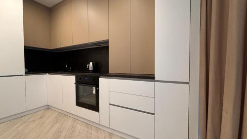 O bucătărie sau chicinetă la Nova ApartHotel
