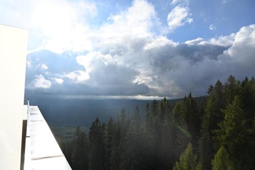 a view of the ocean under a cloudy sky at Luxusný apartmán v Hoteli Panorama s výhľadom na hory in Štrbské Pleso