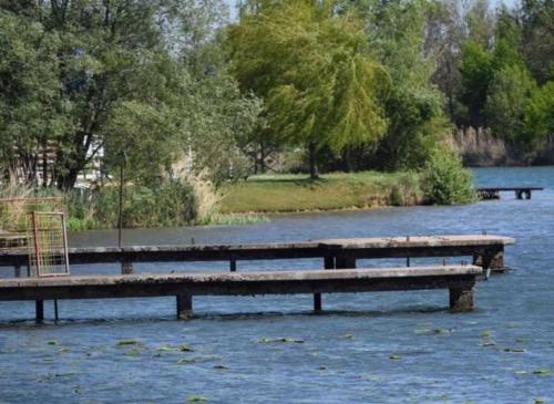 two picnic tables in a river with water at Camping 3 étoiles - efaicg in Auxonne