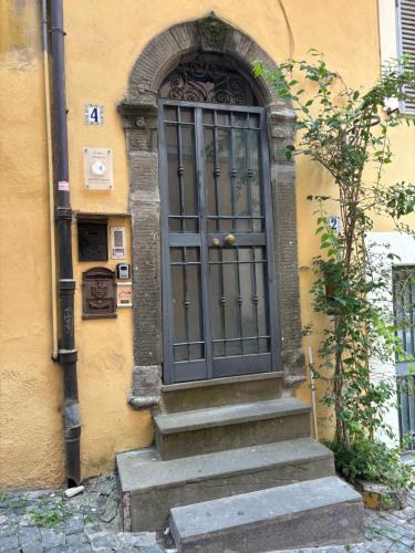 a door with stairs in front of a building at Borgo DiVino in Marino