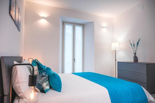 Postel nebo postele na pokoji v ubytování Gavirate Lake apartment