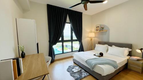 a bedroom with a bed and a large window at Bandar Gamuda Cove Splash Mania Fully Air Con Suite, 42700 Banting, Selangor in Banting