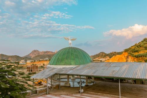 a building with a bird on the top of it at Clarks Resort The Archi`s Castle, Ajmer in Ajmer