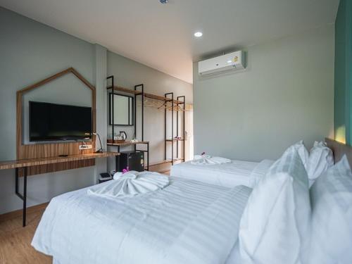 The Tree Riverside Resort Kaeng Krachanにあるベッド