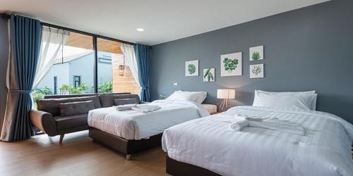 The Tree Riverside Resort Kaeng Krachanにあるベッド
