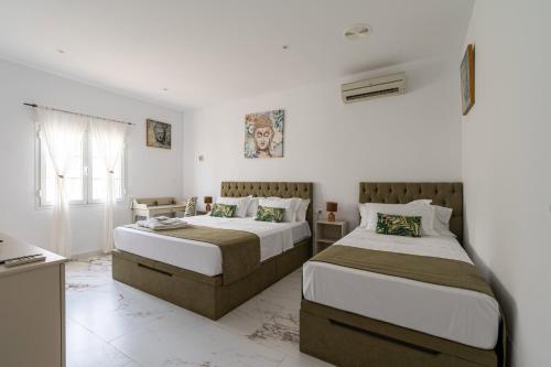 Postel nebo postele na pokoji v ubytování Casa Vista del Rey 77