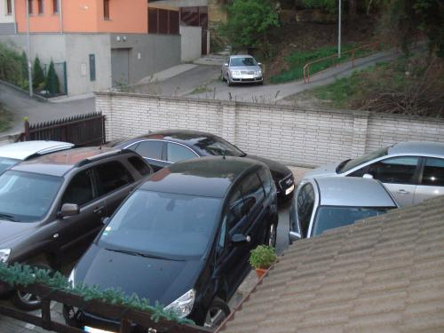 a bunch of cars parked in a parking lot at Penzion Chaloupka in Prague