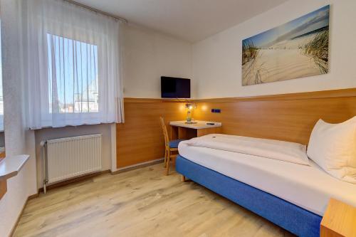 Ένα ή περισσότερα κρεβάτια σε δωμάτιο στο Hotel Post