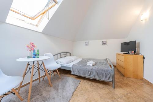 Postel nebo postele na pokoji v ubytování Pensjonat Kwiatkowski apartament nr 1