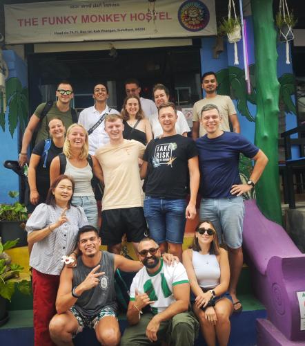 a group of people posing for a picture on a slide at The Funky Monkey Hostel - 18 to 40 years old only in Haad Rin