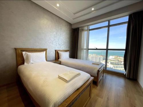 Postel nebo postele na pokoji v ubytování Seafront 2 Bedrooms flat