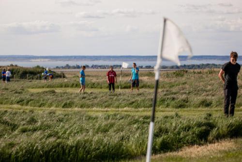 a group of people playing a game of frisbee at The Piglet 4 in Yarmouth
