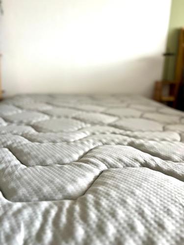 a close up of an unmade bed in a bedroom at Ferienwohnung Wolkenfrei mit Pool und Sauna in Scheidegg