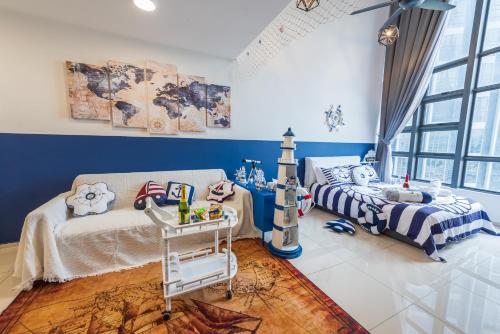 a childs bedroom with two beds and a lighthouse at Ekocheras Cozy Loft in Kuala Lumpur