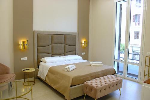 Postel nebo postele na pokoji v ubytování InCentro Elegant Rooms