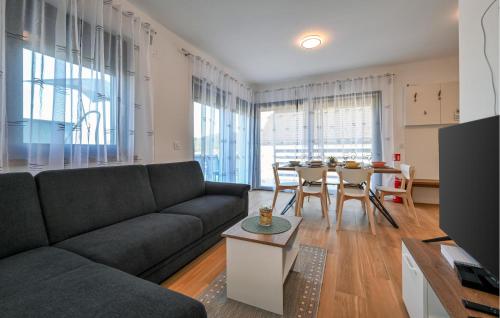 a living room with a couch and a table at Pet Friendly Home In Margecan in Gačice