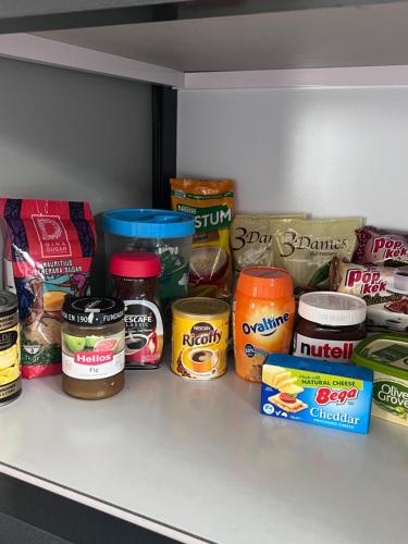a refrigerator shelf filled with different types of food at Teisha House in Souillac