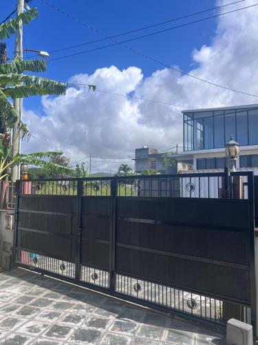a black gate in front of a house at Teisha House in Souillac