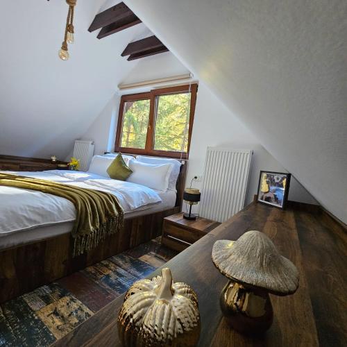 a bedroom with a bed with a hat on the floor at Wild House in Sinaia