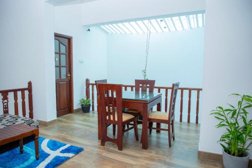 a dining room with a table and chairs at VDN House in Kalegana