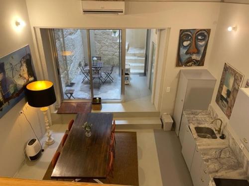 a living room with a wooden table in a room at Oporto Downtown Almada Garden Apartments by LuxiStay in Porto