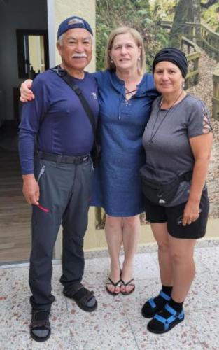 a man and two women posing for a picture at Pensión Casa do Gallo Sarria in Sarria