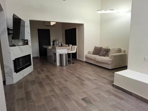 a living room with a sink and a couch at Spacious 3-Bed, 2-Bath Home in Puerto Peñasco