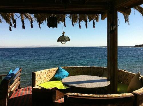 a view of the ocean from a gazebo at فندق جرين فالي دهب - Green Valley Hotel in Dahab