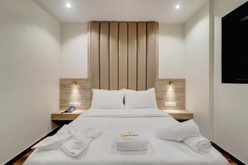 Ένα ή περισσότερα κρεβάτια σε δωμάτιο στο Hotel Amar Residency