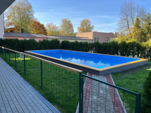 Bazén v ubytování Apartmán v Harmonii 3 patro nebo v jeho okolí
