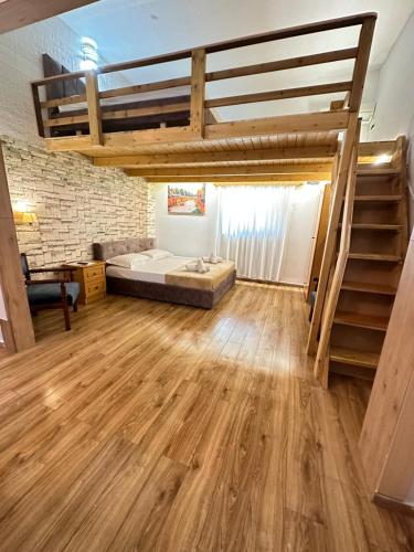 Ένα ή περισσότερα κρεβάτια σε δωμάτιο στο Anel Suites