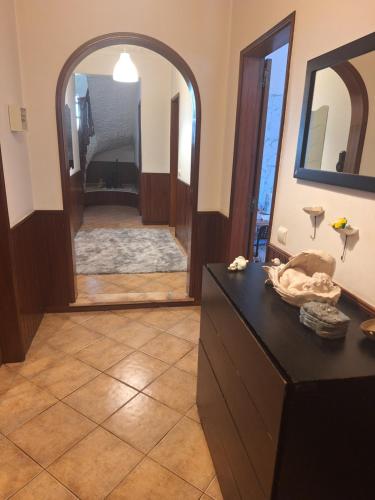 a bathroom with a vanity and a large mirror at sweet susete in Monsoa