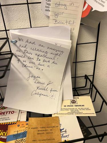 a pile of papers with writing on them at Terrazza Roberto in Cefalù