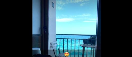 a view of the ocean from a room with a window at Terrazza Roberto in Cefalù