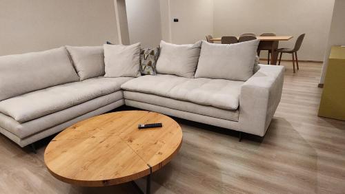 a living room with a couch and a coffee table at Patras Aura - Old Town in Patra