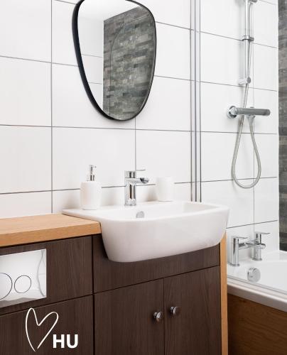 a bathroom with a sink and a mirror at Boutique 1 Bdrm Duplex Suite on Marina 305 in Hull