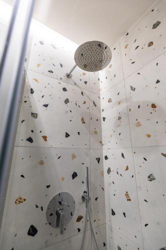 a bathroom with a rock wall with a climbing wall at ENeR Studios in Tirana