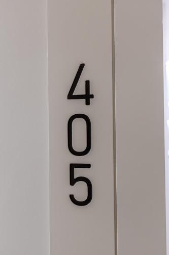 a thermometer with the number four on it at ENeR Studios in Tirana
