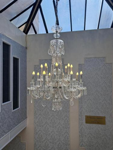 a chandelier hanging from a ceiling in a room at Scarisbrick Hotel in Southport