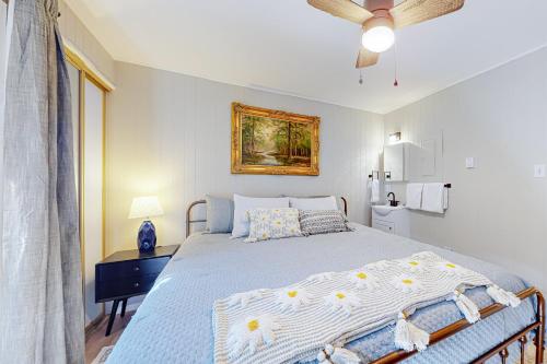 a bedroom with a bed and a ceiling fan at Pinetree 213 in Angel Fire