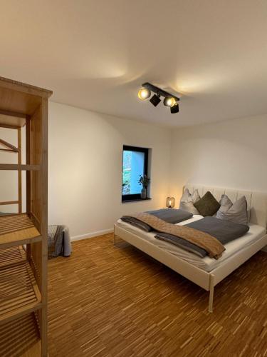 a bedroom with a large bed in a room at Garden Apartment in Buttelstedt