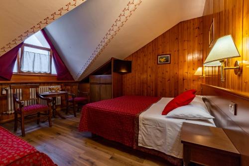 Posteľ alebo postele v izbe v ubytovaní Hotel Beau Sejour Pré-Saint-Didier