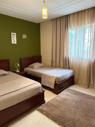 Ένα ή περισσότερα κρεβάτια σε δωμάτιο στο S+2 avec Jardin à l'aouina