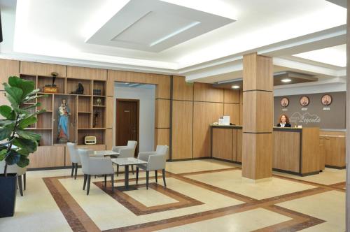 a meeting room with a table and chairs at Legends Hotel in Sofia