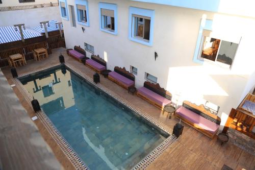 an overhead view of a swimming pool in a building at Imsouane WOOD HOUSE in Imsouane