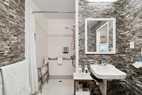 a bathroom with a sink and a mirror at Sonesta Essential Vacaville Napa Valley in Vacaville