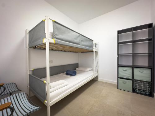 a bunk bed in a small room with a bunk beduteneway at Beachfront Apartment Primera Línea 2-04 in Orihuela Costa