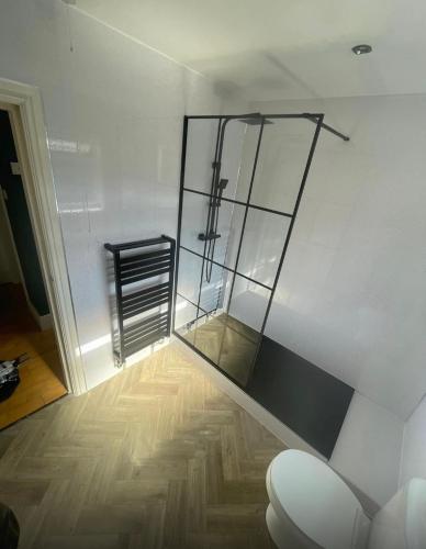 a bathroom with a glass shower in a room at Apartment with balcony West Bridgford in Nottingham